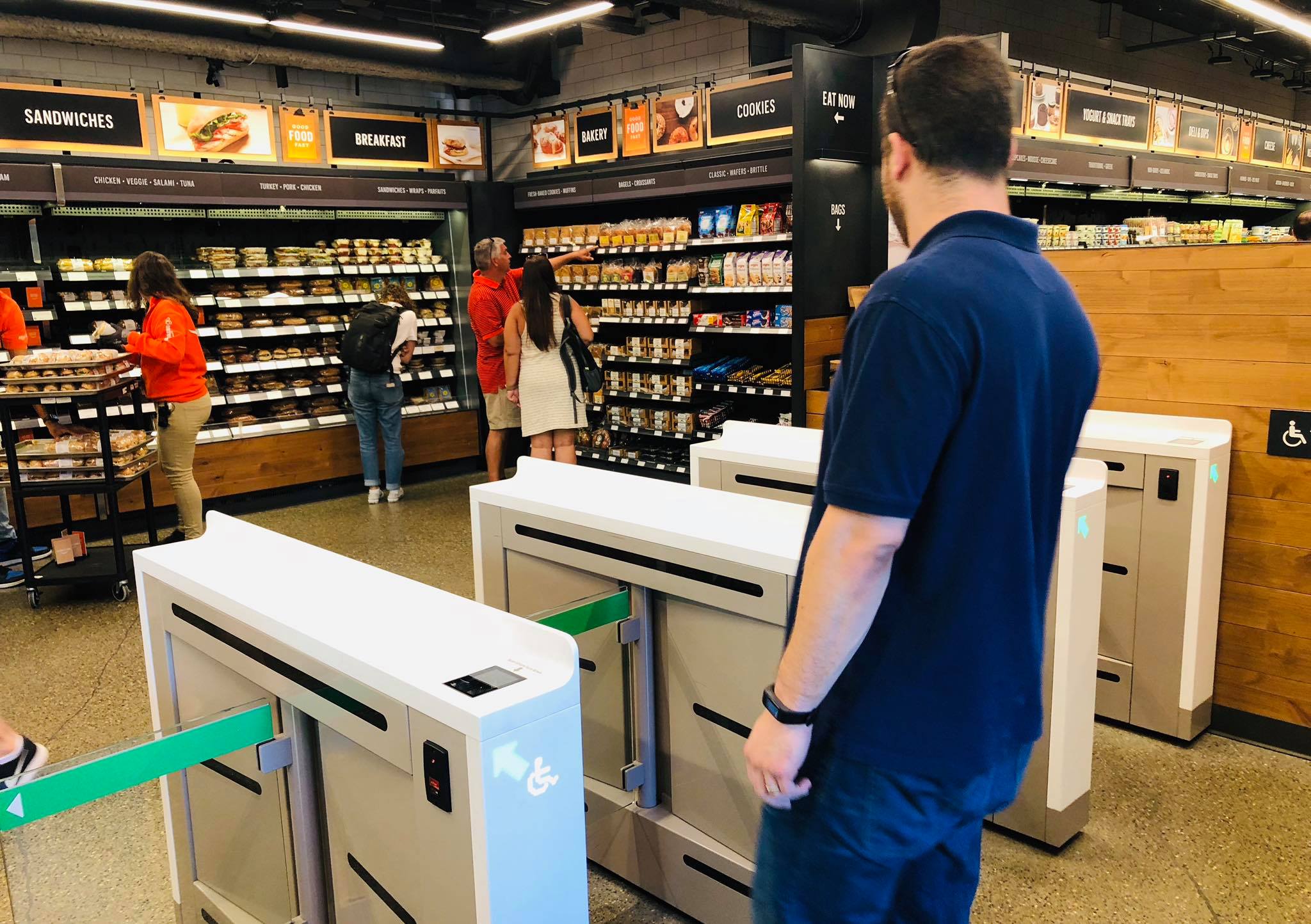 Gates at the entrance of Amazon Go, where shoppers scan into the store instead of checking out at a register.